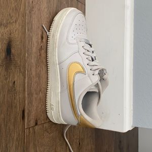 Nike gray and gold air forces